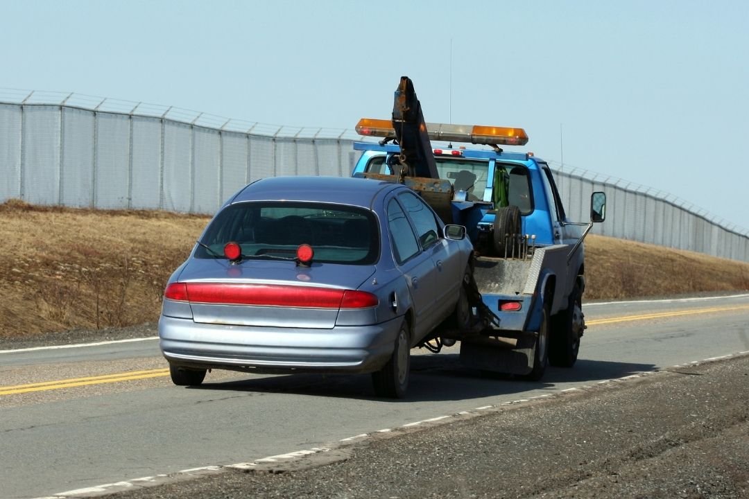 Tow truck assisting a vehicle on the road